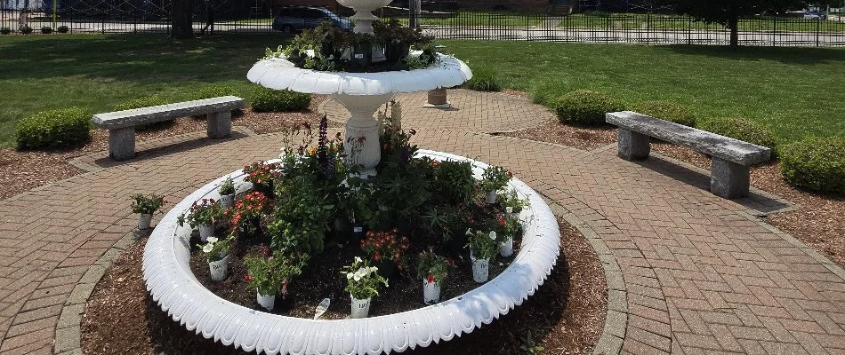 Paver walkway around a plant fountain in Groton, CT.