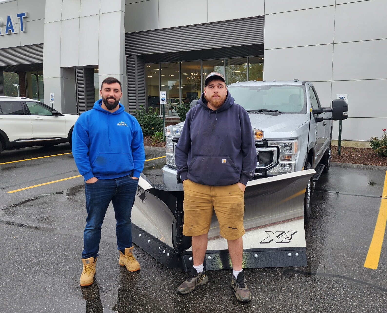 Jordan and CJ, owners of American Ground and Snow Management, on the day they bought their first brand-new commercial truck