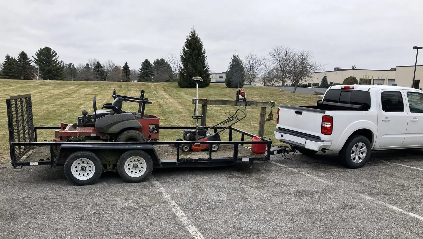 Commercial grounds maintenance Connecticut crew equipment loaded on a trailer