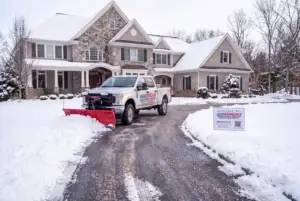 AGSM plow truck on a freshly plowed driveway in Mystic, CT
