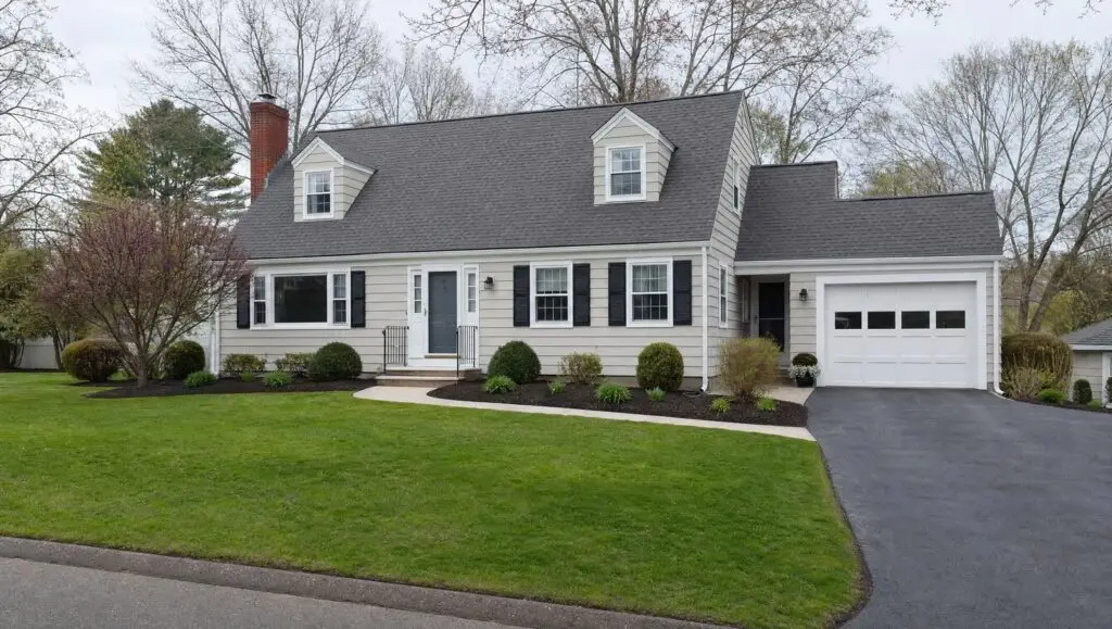 Spring cleanup finished with fresh mulch beds and a first cut at a Connecticut home
