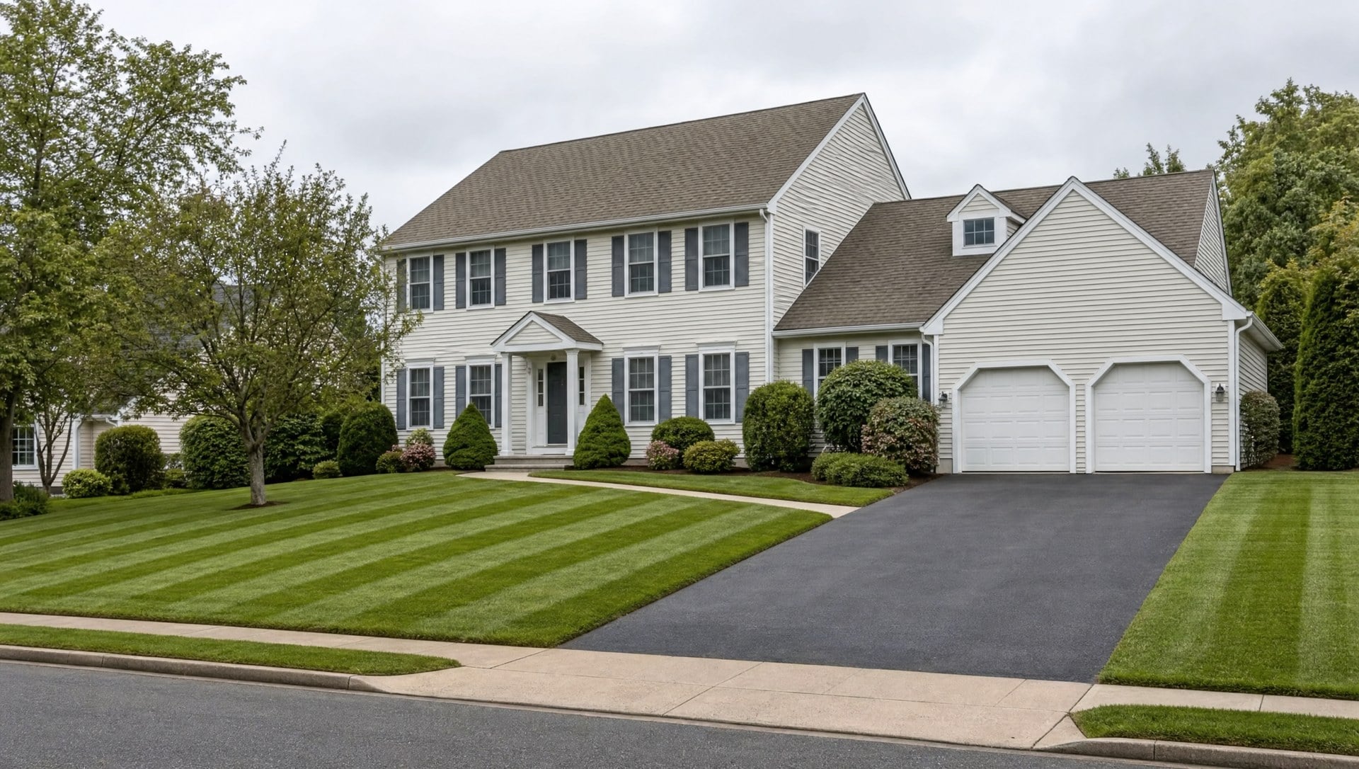 Freshly mown striped front lawn at a home in Mystic CT