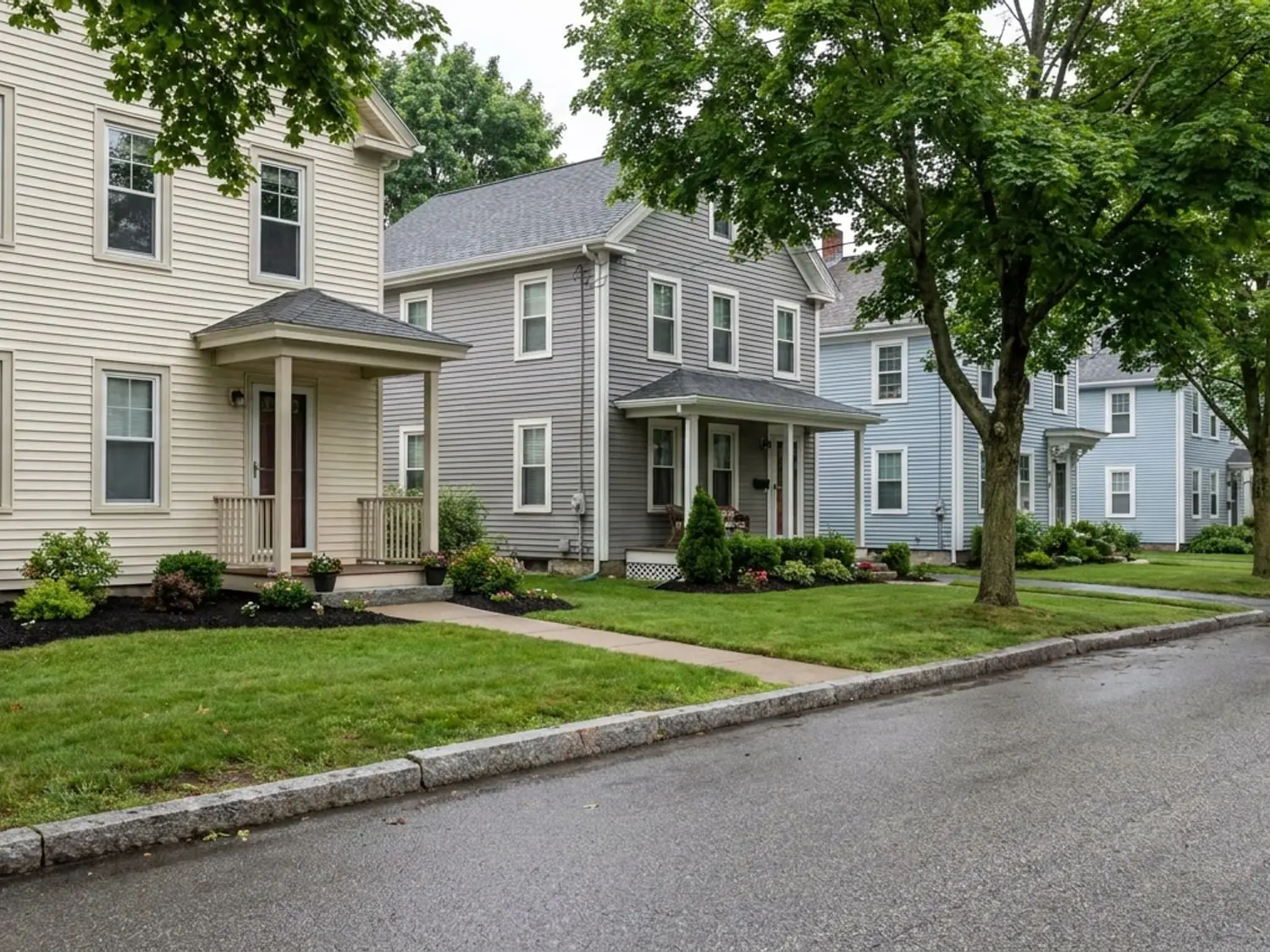 Small freshly cut front lawns on a compact village street in Pawcatuck CT