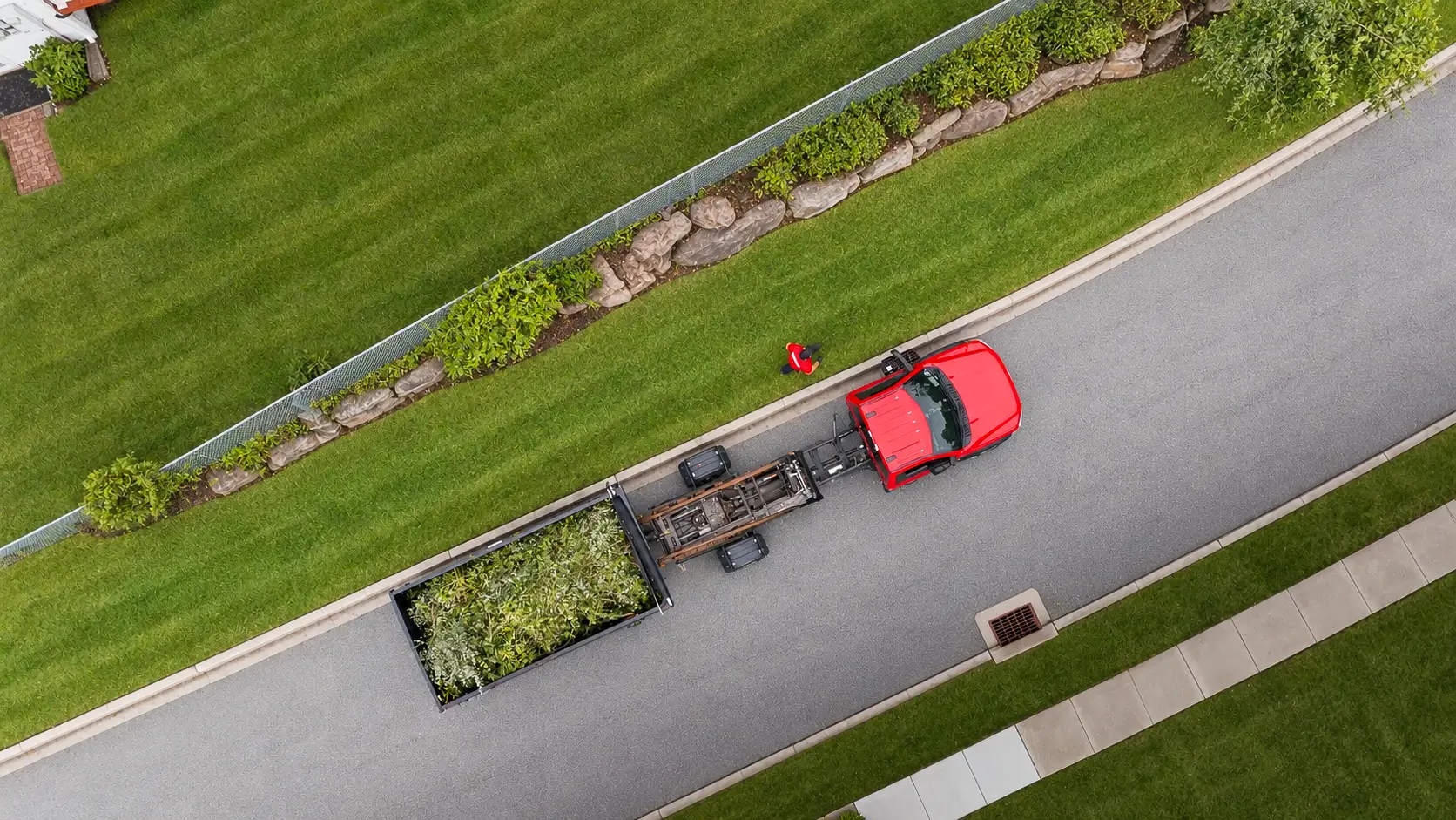 Aerial view of an AGSM crew and trailer during a fall cleanup in Mystic, CT