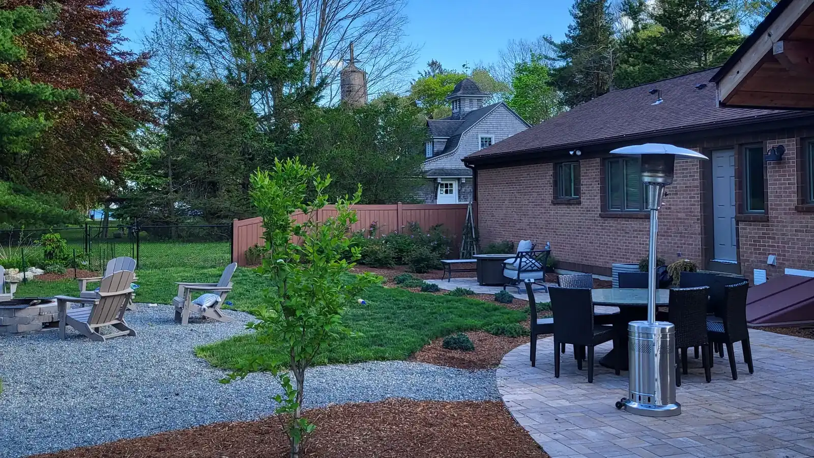 Backyard patio, planting beds and gravel built by AGSM, landscaping services in Mystic CT