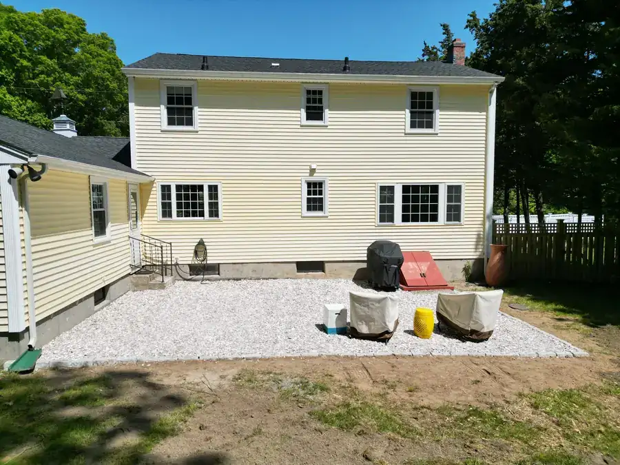 Crushed stone patio installed behind a house by AGSM