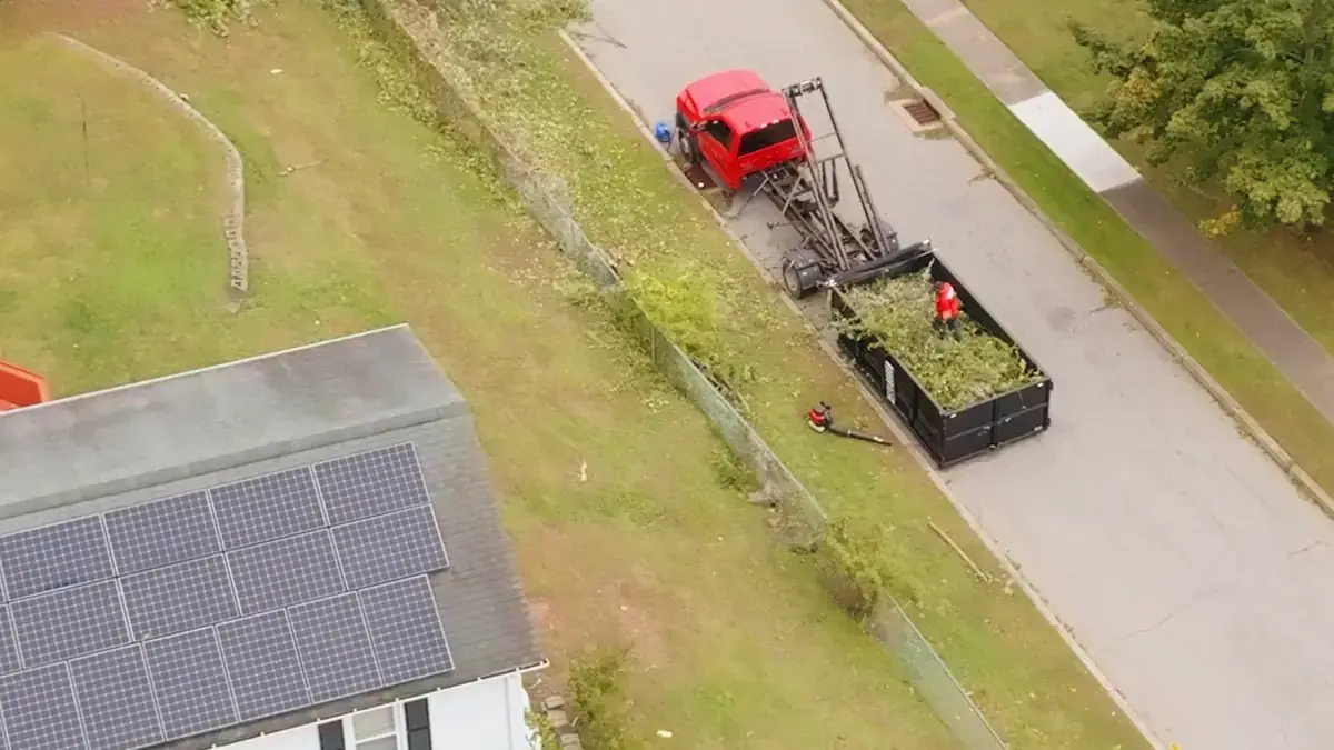 Aerial view of an AGSM truck and trailer loaded with brush during a fall cleanup in Connecticut