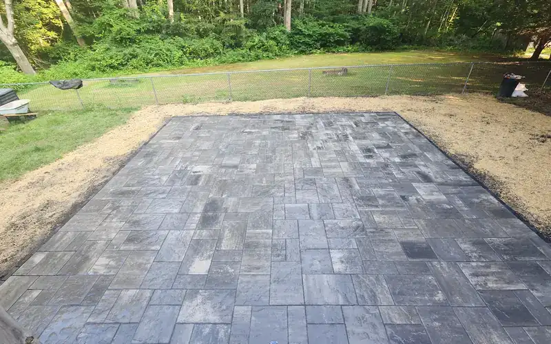New paver patio built in a backyard by AGSM