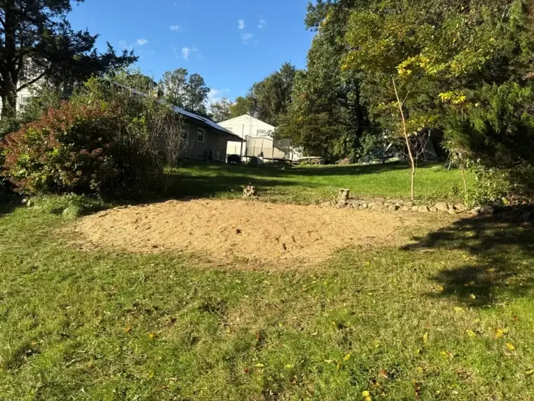 Shrub removal and lawn conversion in Gales Ferry, CT, after: overgrown shrub bed removed and graded for lawn